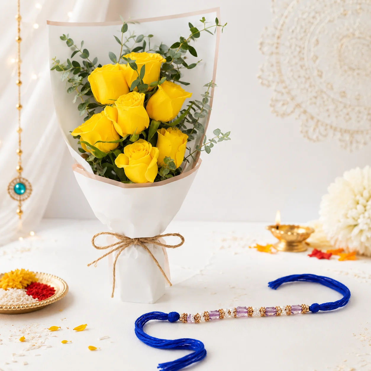 Yellow Rose Bouquet with Blue Bead Rakhi featuring seven fresh yellow roses and an elegant blue bead rakhi for Raksha Bandhan